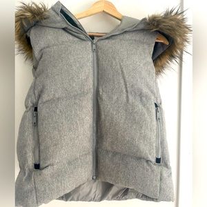 Warm puffer vest with faux fur trim hood